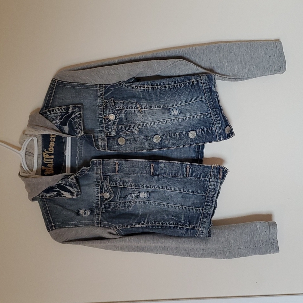 Jean jacket with light gray hood and sleeves.